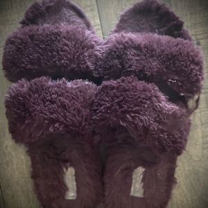 Worn purple fuzzy slippers